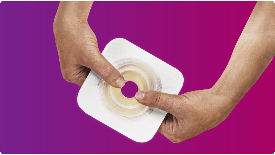 hands holding a Convatec Mouldable Technology baseplate