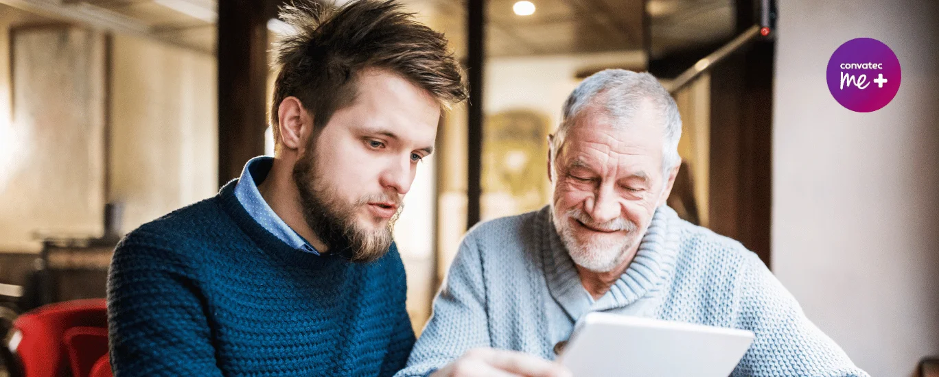 a man looking at a laptop